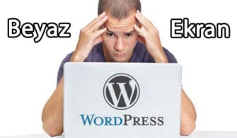 Portrait of a nervous young man looking at laptop against white background