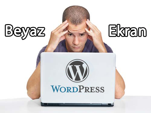 Portrait of a nervous young man looking at laptop against white background